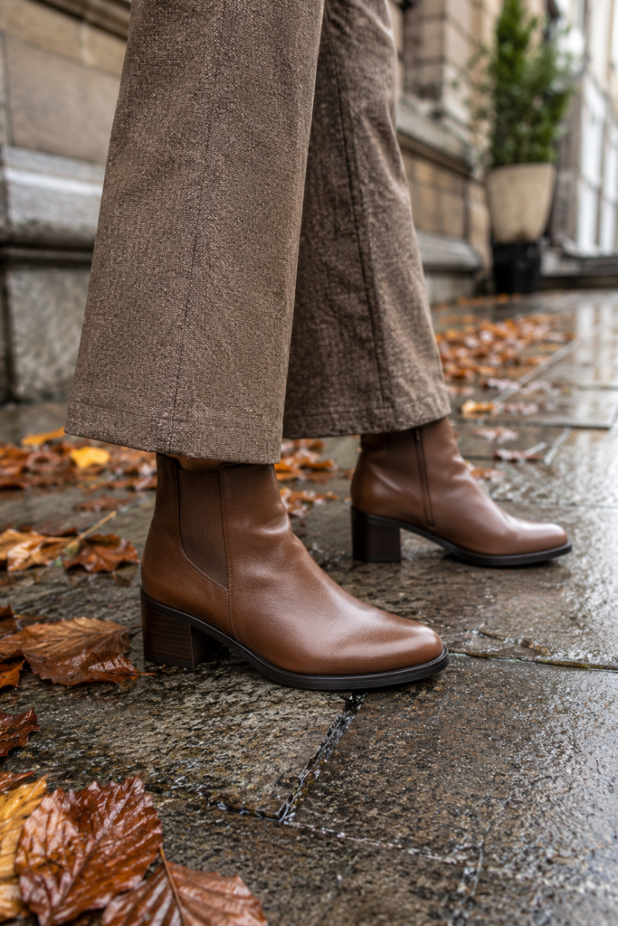 Brown block heel ankle boots styled with a fall outfit for all day comfort