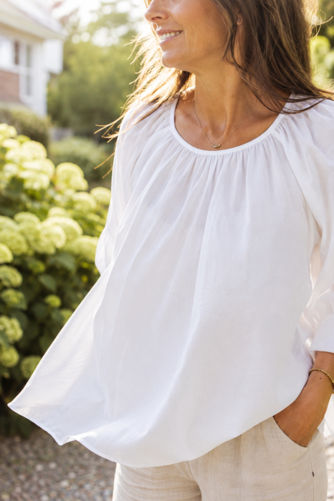 Close up of lightweight cotton poplin fabric moving in the breeze, spring outfit detail