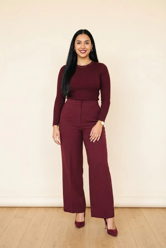 Curvy woman wearing an all burgundy monochrome outfit
